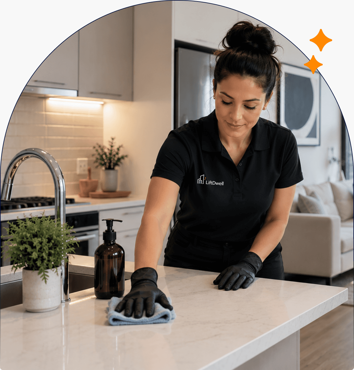 A LiftDwell professional cleaning a condo kitchen countertop
